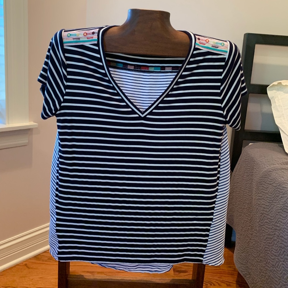 V-neck blouse with Aztec-Inspired details.